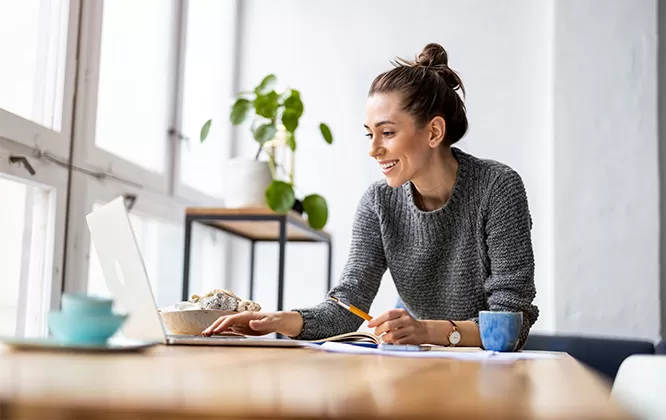woman smiling at computer
